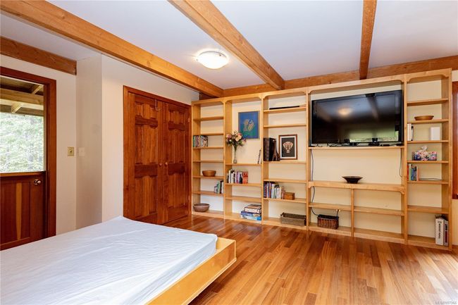 Lots of built in shelves in the family room | Image 56