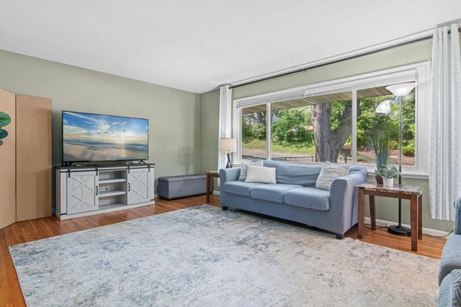Plenty of space in this sun-filled main level living room. | Image 4