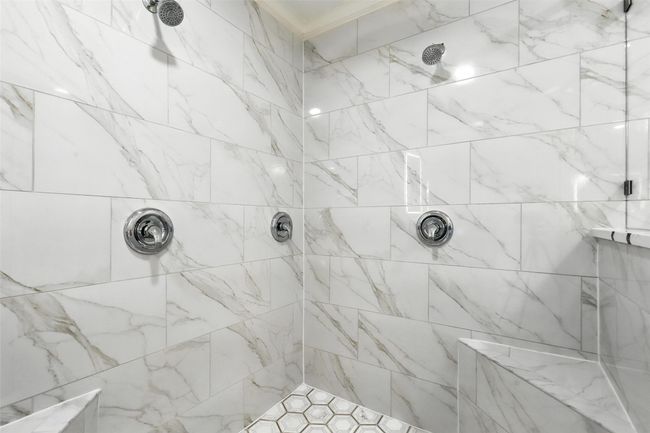 Bathroom with a tile shower and ornamental molding | Image 23