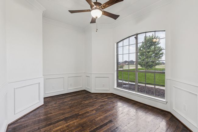 Living room at the front of the house could be an office or den | Image 7
