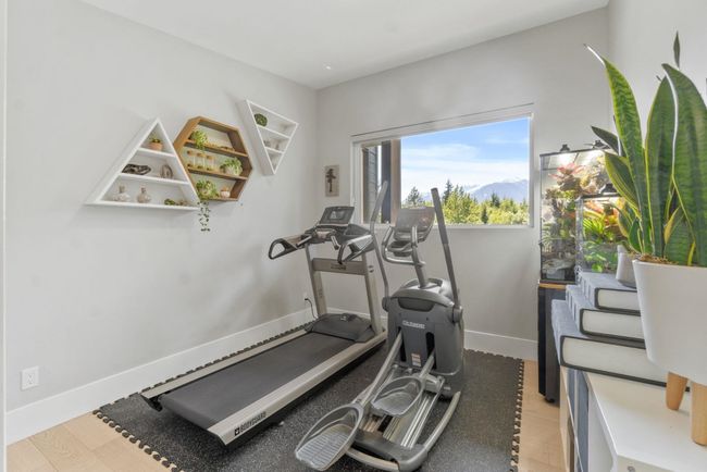 Workout room with baseboards and light wood-style floors | Image 27