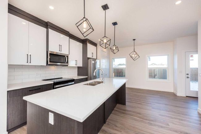 64 Midtown Close Sw, Home with 4 bedrooms, 3 bathrooms and 2 parking in Airdrie AB | Image 8