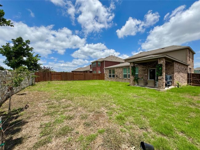 Fenced backyard featuring a patio area | Image 32