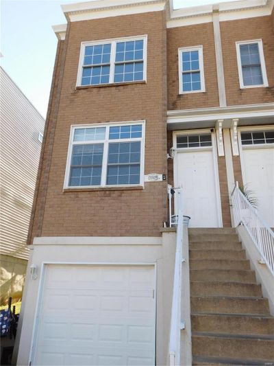 View of front of home featuring a garage | Image 1