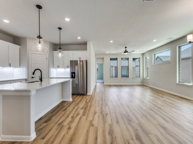 With a view to the dining and family rooms, the chef will never be left out of the party in this dream home! | Image 8