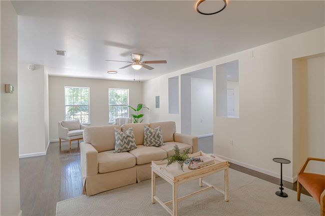Living room featuring ceiling fan and light hardwood / wood-style flooring | Image 17