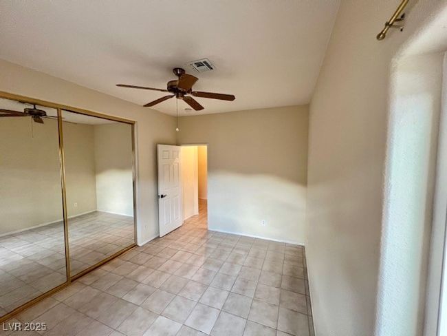 Empty room with recessed lighting, baseboards, and light tile patterned floors | Image 24