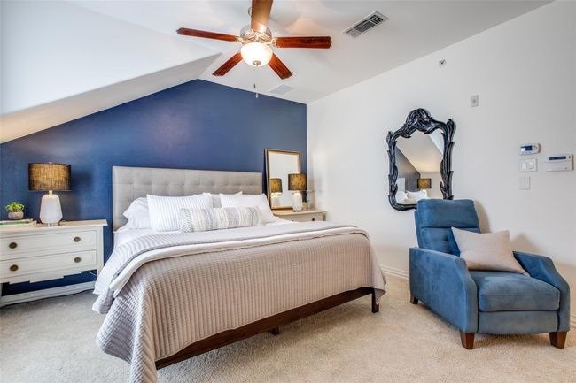 Carpeted bedroom featuring lofted ceiling and a ceiling fan | Image 14