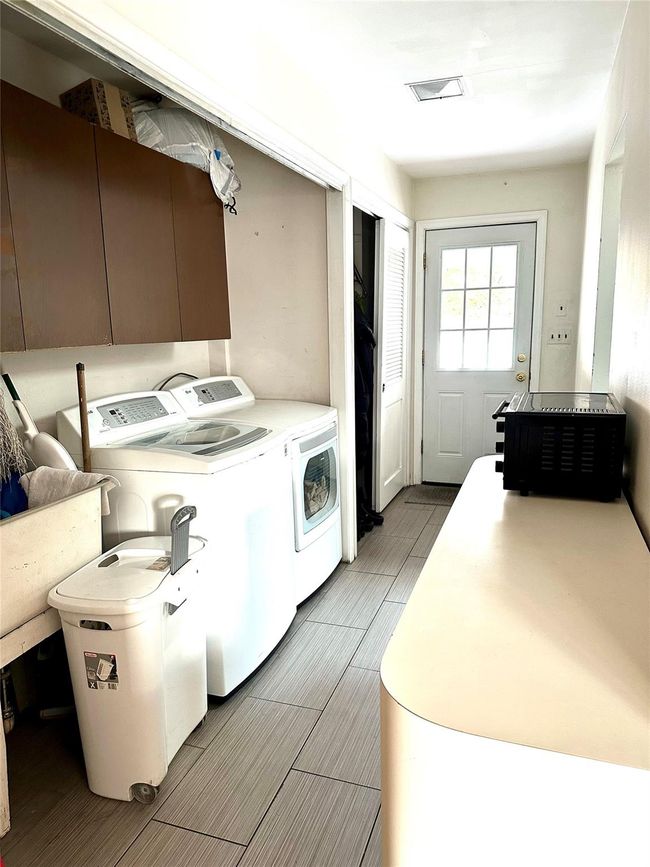 Laundry room with washer and clothes dryer | Image 10