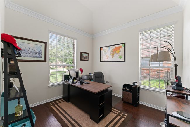 Home office with plenty of natural light, dark wood-style floors, and ornamental molding | Image 15