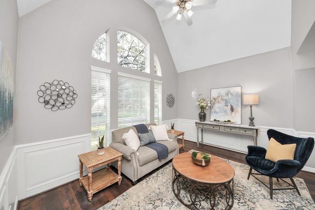 Love the Palladian Window in the living room. Notice the beautiful mill work and vinyl plank flooring. | Image 4