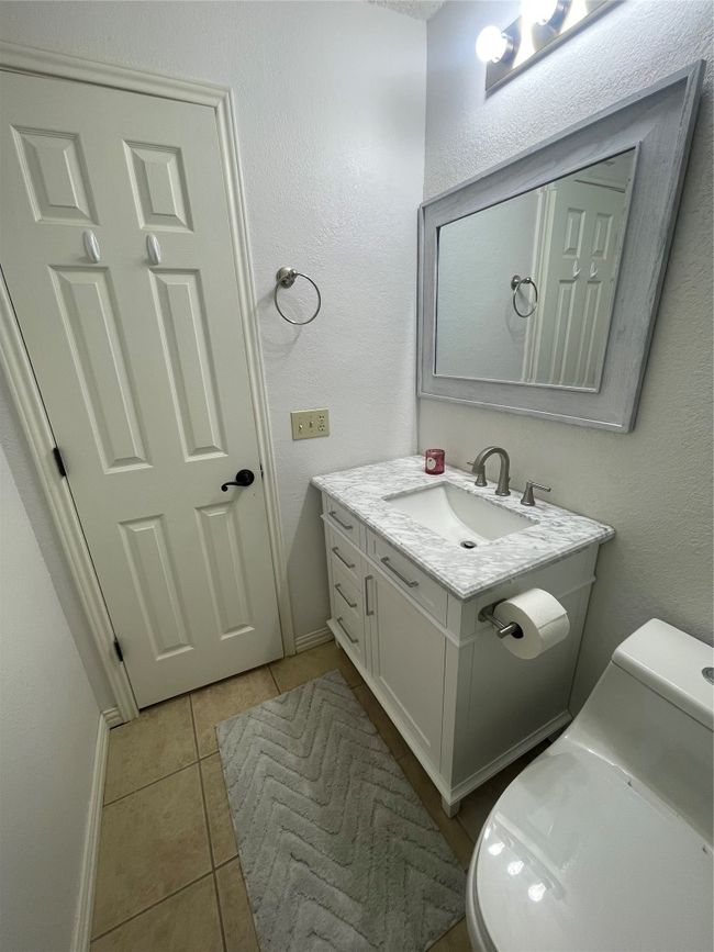 Half bathroom featuring tile patterned flooring and vanity | Image 17