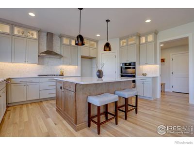 Double ovens, a gas cooktop and a real vented hood. Gorgeous brand new kitchen! | Image 3