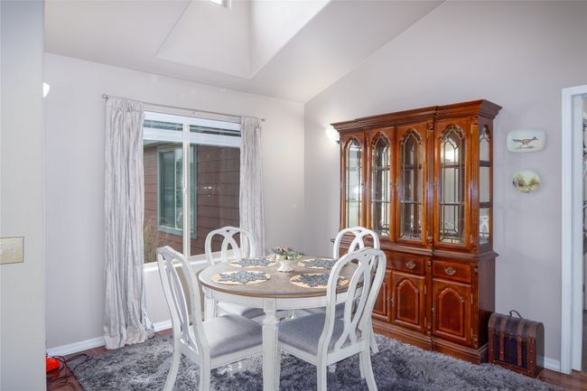 Dining area featuring baseboards and vaulted ceiling | Image 36