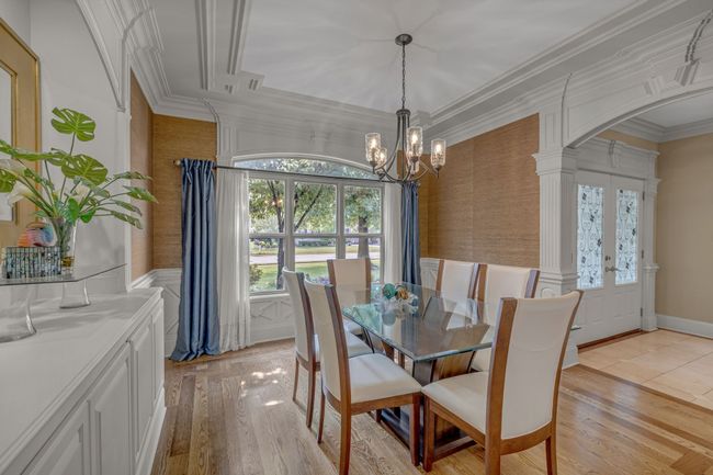 A captivating formal dining room with built-ins and inlay. | Image 9
