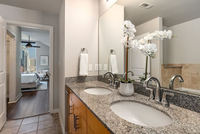 Ensuite bathroom featuring double vanity and tile patterned floors | Image 10