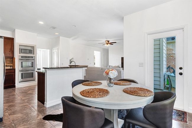 open-concept living area, kitchen, and breakfast room | Image 15