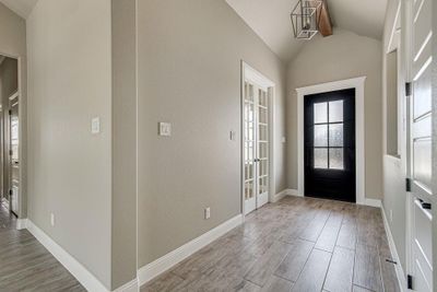 Foyer featuring light hardwood / wood-style flooring and vaulted ceiling | Image 2