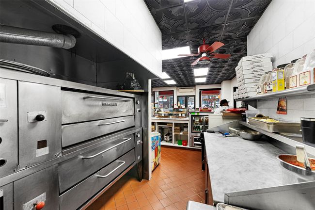 Kitchen with an ornate ceiling and ceiling fan | Image 4