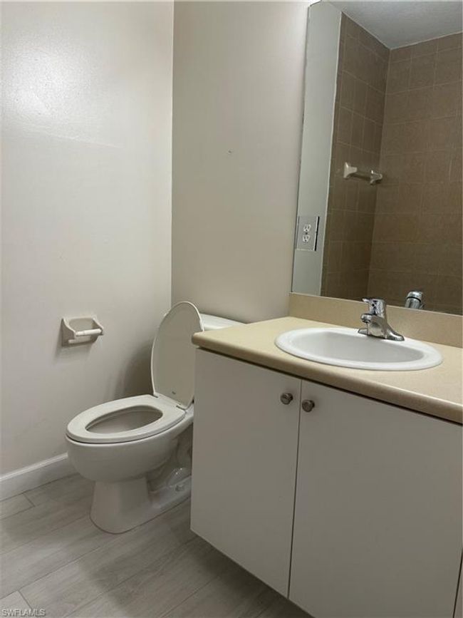 Bathroom featuring vanity and toilet | Image 6