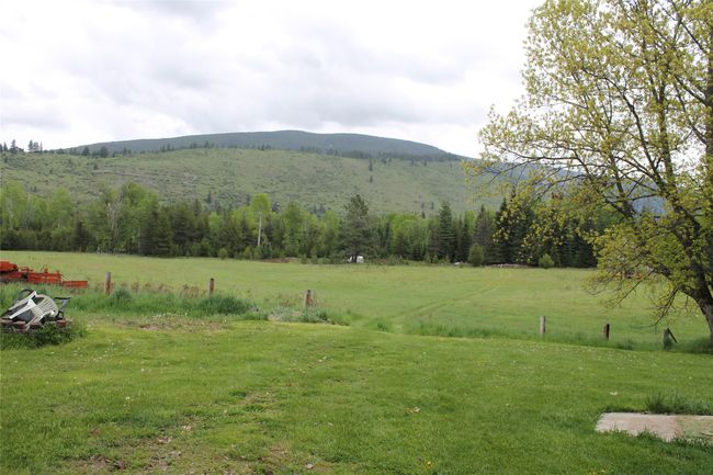 View of mountain backdrop featuring rural landscape | Image 14
