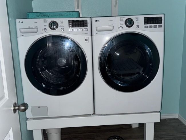 Washer and dryer in laundry room in house | Image 16