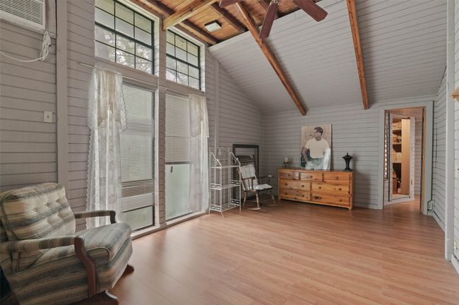Cathedral ceilings welcome you into the 2nd primary bedroom on the other end of the homes from the first. | Image 19