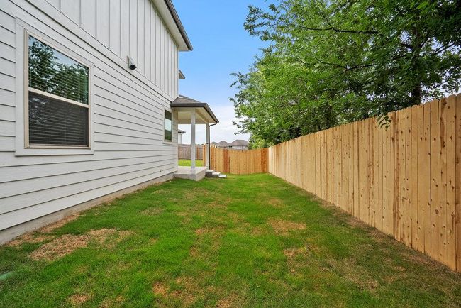 View of fenced backyard | Image 27