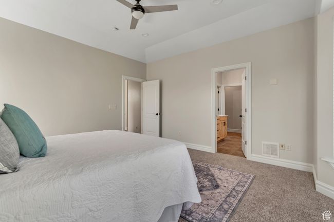 Bedroom with carpet, a ceiling fan, and ensuite bathroom | Image 16