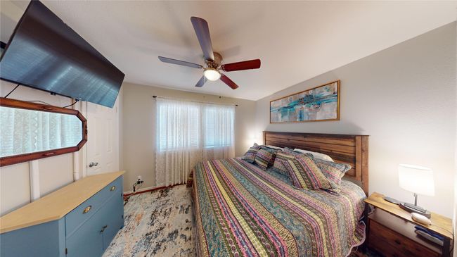 Bedroom featuring a ceiling fan and baseboards | Image 12
