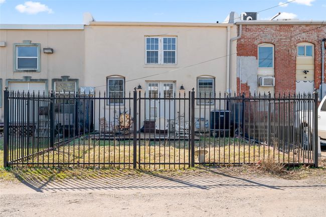View of front of property featuring a fenced front yard, brick siding, and stucco siding | Image 37