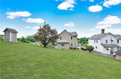 Large semi-private yard backs to some woods | Image 2