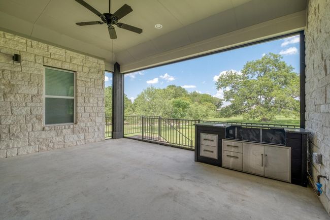 View of patio / terrace featuring area for grilling and a ceiling fan | Image 28