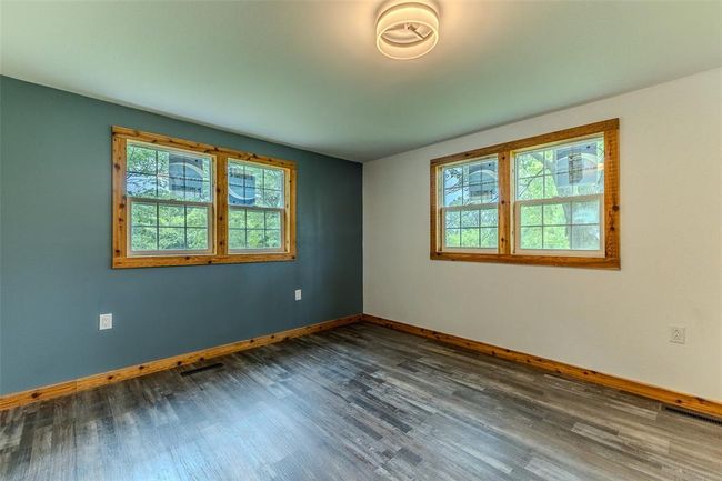 Unfurnished room with plenty of natural light and baseboards | Image 32