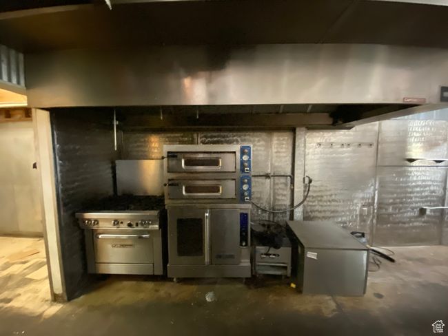 Kitchen featuring concrete floors | Image 45