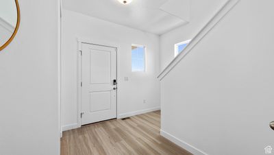 Foyer entrance with light wood-type flooring | Image 2