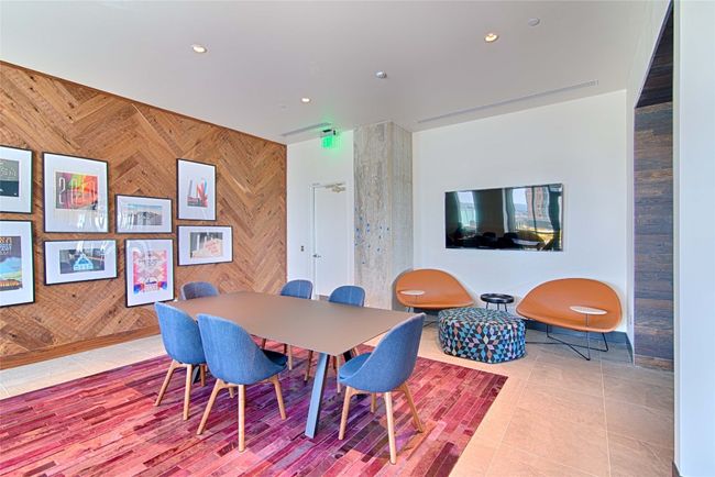 Tiled dining space with recessed lighting and wood walls | Image 22