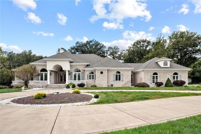 View of front of property with a front yard and covered porch | Image 1