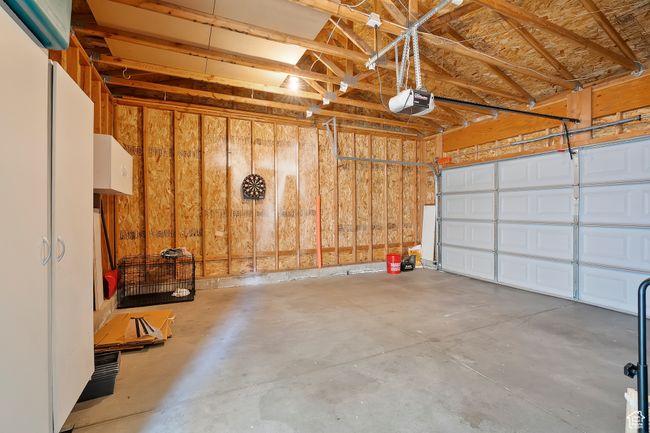 Garage with a garage door opener | Image 27