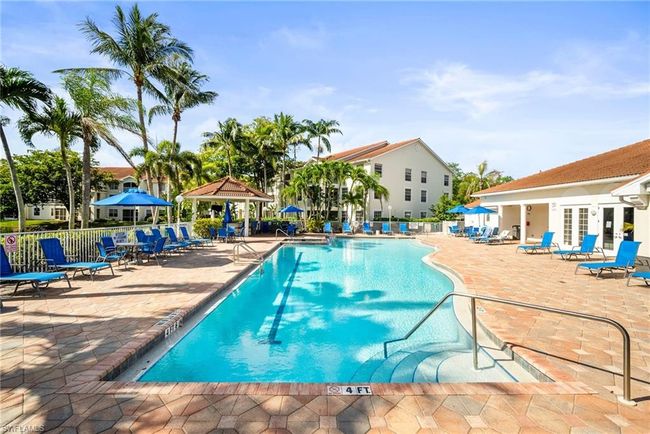 Community pool featuring french doors, a gazebo, fence, and a patio area | Image 39