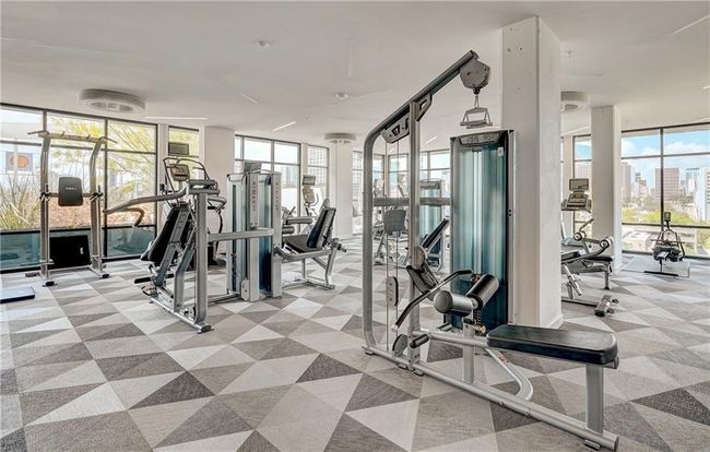 Amenity alert: Generously sized fitness center with floor to ceiling windows with amazing downtown views! | Image 26