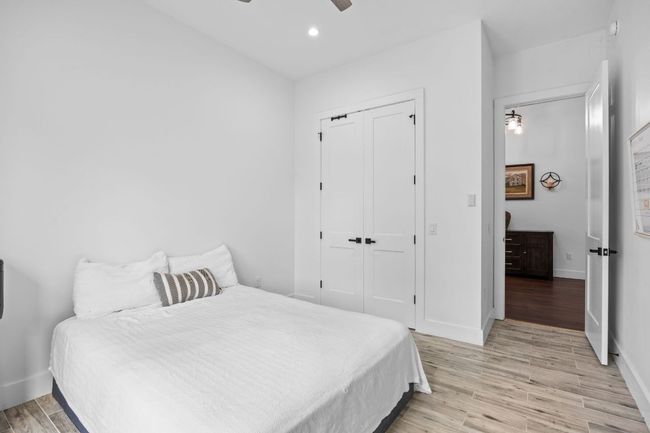 Bedroom with light wood-style floors, a closet, recessed lighting, and ceiling fan | Image 21