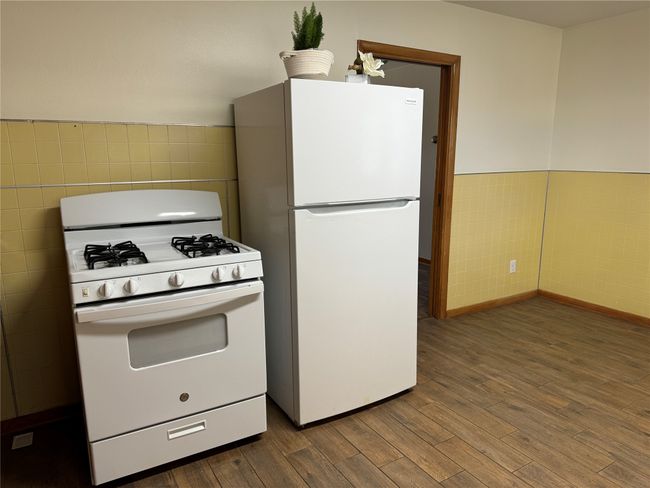 Unit B kitchen with area for table & chairs. | Image 10