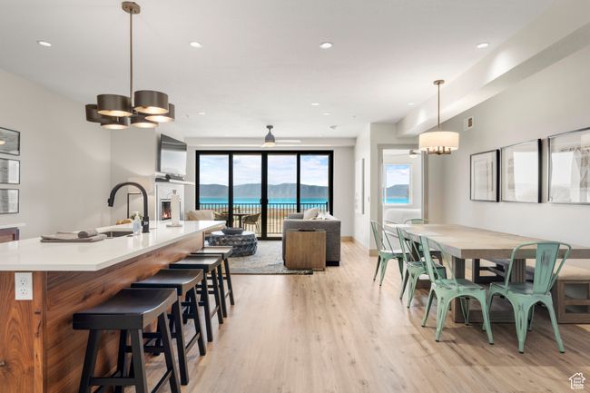 Dining area featuring light wood finished floors, a chandelier, and recessed lighting | Image 41