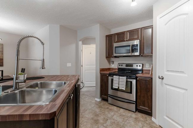 104 - 90 Panatella Landing Nw, Home with 2 bedrooms, 1 bathrooms and 1 parking in Calgary AB | Image 6