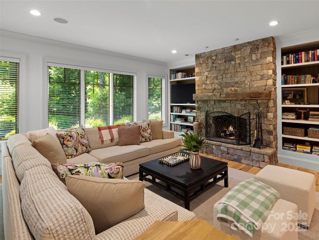 Five-foot stone circular gas-fed fire pit is accessible from the lower level or steps down from rear deck. | Image 39
