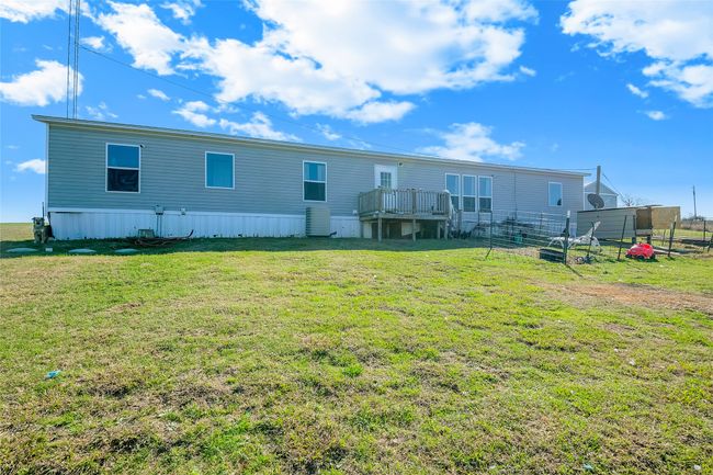 Back of property featuring a wooden deck and a lawn | Image 11