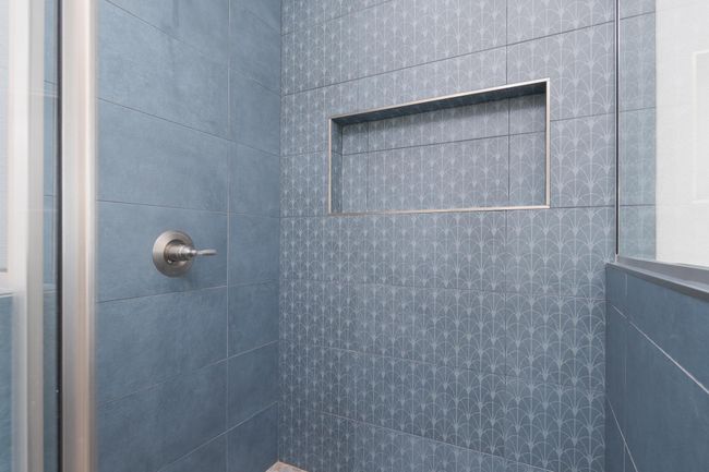 Bathroom featuring a tile shower | Image 23