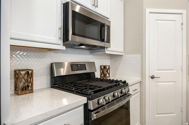 Quartz counters with room for meal prep | Image 9