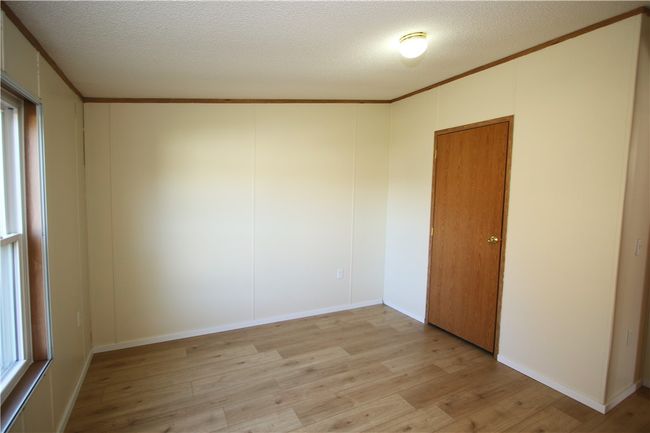 Nice 11x10 Bedroom w/ Newer Rockwood Oak Vinyl Plank Flooring, Freshly Painted & Deep Tall Closet | Image 18
